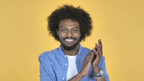Applauding Afro-American Man, Clapping on Yellow Background Stock Footage 99221344