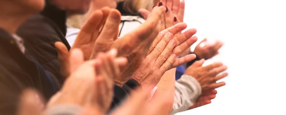 Applause - Clapping hands of a group of people in a row 库存照片