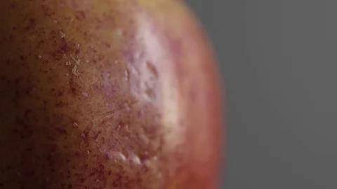 An Apple against a subtle soft background UHD stock footage Stock Footage 82197912