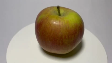An apple in all its colors: close-up on the turntable Stock Footage 239182603