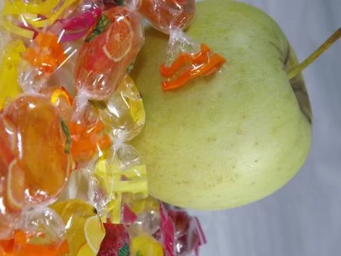 An apple and boiled fruit sweets Stock Photos