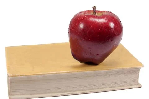 Apple and book Stock Photos