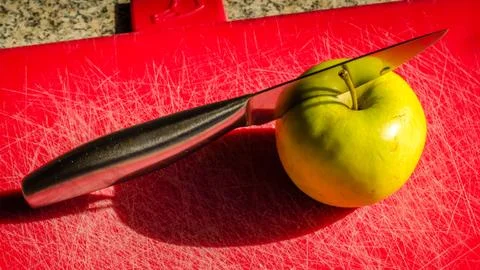 Apple and a knife Stock Photos
