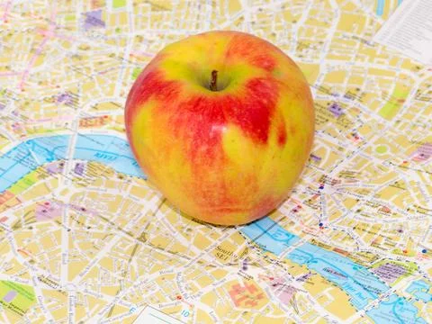 Apple and a map Stock Photos