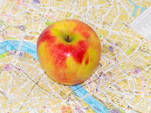 Apple and a map Stock Photos
