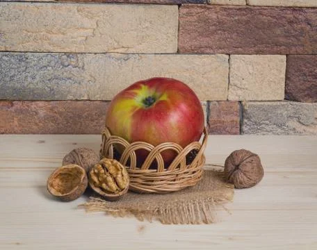 Apple and nuts in basket Stock Photos