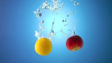 Apple and orange in the water-2 Stock Footage 215012845