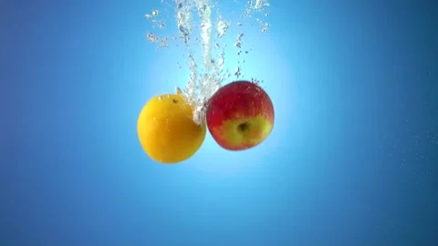 Apple and orange in the water Stock Footage 215012985