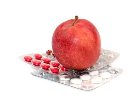 Apple and pill Stockfoto's