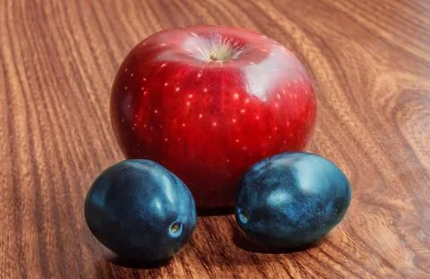 Apple and plums Stock Photos
