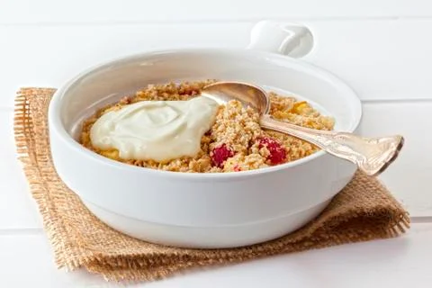 Apple and raspberry crumble Stock Photos