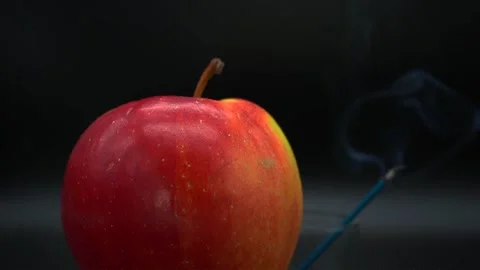 Apple and smoldering stick Stock Footage 140899434