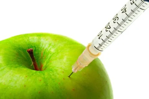 Apple and syringe Stock Photos