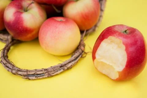 Apple in basket on yellow background composition and concept of autumn Stock Photos