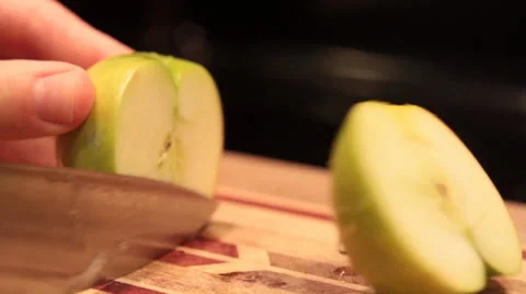 Apple Being Cut in Half Stock Footage 34480628