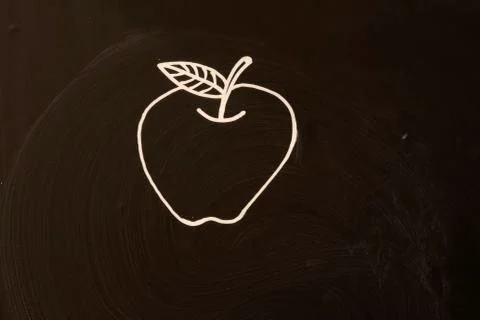 Apple on blackboard Stock Photos