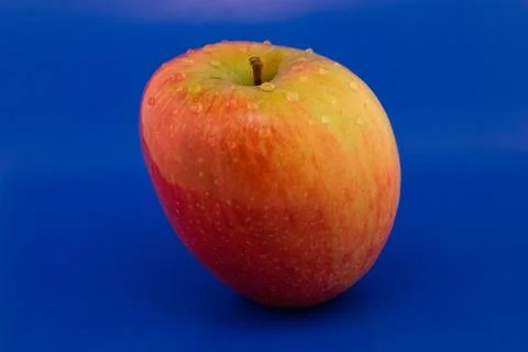 Apple on a blue background Foto stock