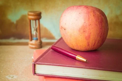 Apple on the book. Stock Photos