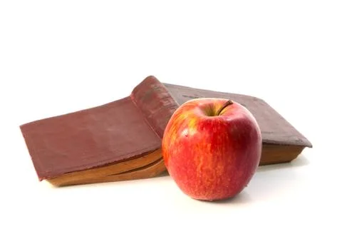 Apple on an book Stock Photos