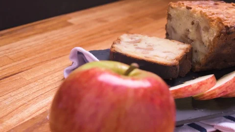 Apple Bread Cake Pan Close Up On Black Slate With Sliced Apples Over Wood 2 Video stock 128092723