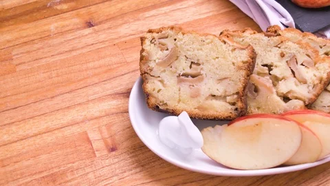 Apple Bread Cake Three Portions on White Plate Close Up Over Wood 3 Video stock 128092327