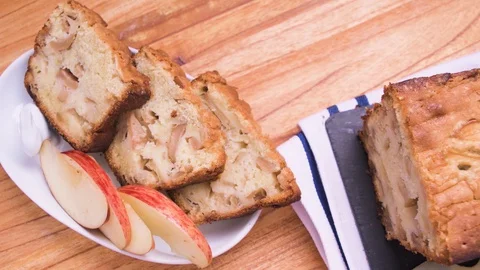 Apple Bread Cake Three Portions on White Plate Close Up Over Wood Video stock 128092546