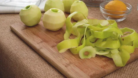 Apple cake with biscuit base recipe. Peeled green apples Stock Footage 169411045