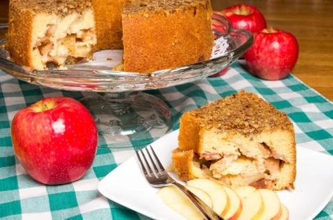 Apple cake on display with red apple Stock Photos