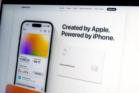 Apple card displayed on iphone and laptop screen showing website landing page Stock Photos
