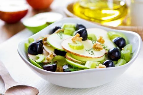 Apple with celery, grape and walnut salad Stock Photos
