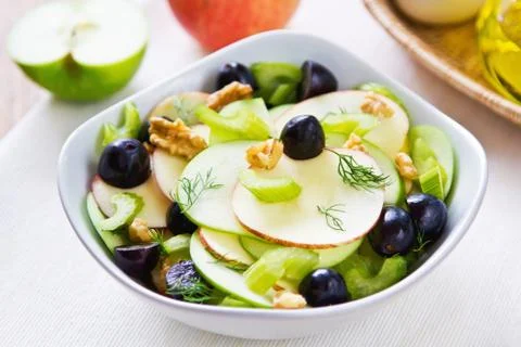Apple with celery, grape and walnut salad Stock Photos