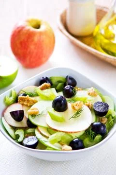 Apple with celery, grape and walnut salad Stock Photos