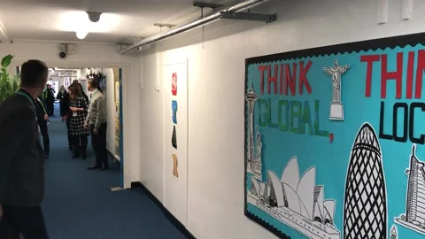Apple CEO Tim Cook tours primary school in north London Stock Footage 148698226