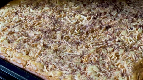 Apple charlotte on a baking sheet in the oven Video stock 337514495