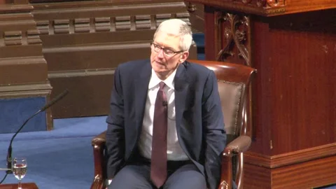 Apple chief Tim Cook comments on Trump as he collects honorary doctorate in Stock Footage 148698426