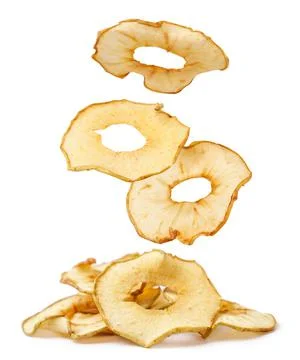 Apple chips are falling on a heap on a white background. Isolated Stock Photos
