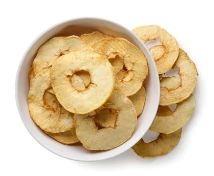 Apple chips in a plate on a white background. Top view Stock Photos