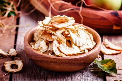 Apple chips, still life in rustic style, vintage wooden background, selective Stock Photos