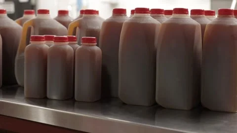 Apple Cider being displayed on a counter Stock Footage 250193386