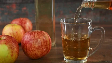 Apple cider vinegar in a cup Stock Footage 283898310
