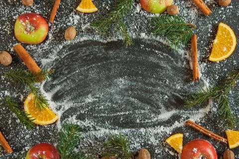 Apple cinamon nutmeg orange snow green fir branches new year Stock Photos