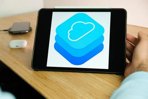Apple cloudkit logo on the screen of iPad tablet with smart phone iPhone Stock Photos