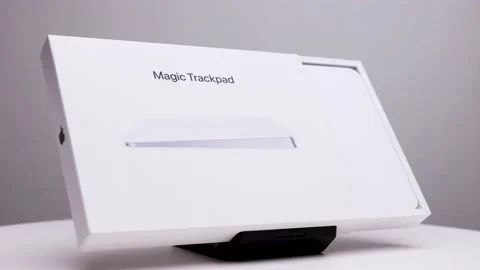 Apple company logo visible on the side of half opened white package box of Stock Footage 174712525