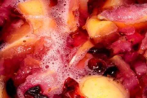 Apple compote with berries.Background of Apple compote with berries. Stock Photos
