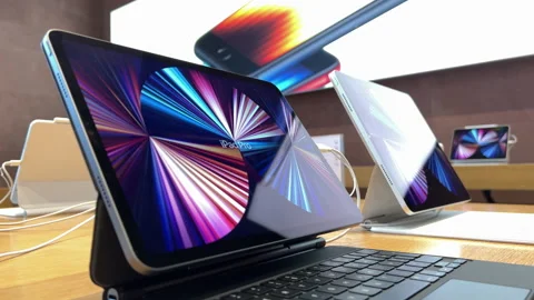 Apple Computers Store interior with row of new iPad Pro on magic floating Stock Footage 202171155