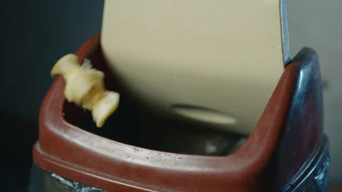 Apple Core Falling into Kitchen Trash Bin in Slow Motion | Food Waste Disposal Stock Footage 326843539