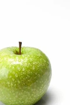 Apple covered with dew droplets. Stock Photos