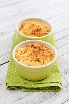 Apple crumble in small baking dish Stock Photos