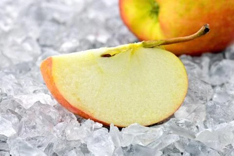 Apple on crushed ice Stock Photos