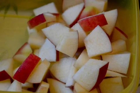 Apple cubes in container close-up 写真素材